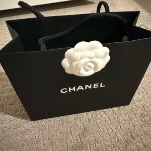 Chanel Black Shopping Bag with White Flower Accent